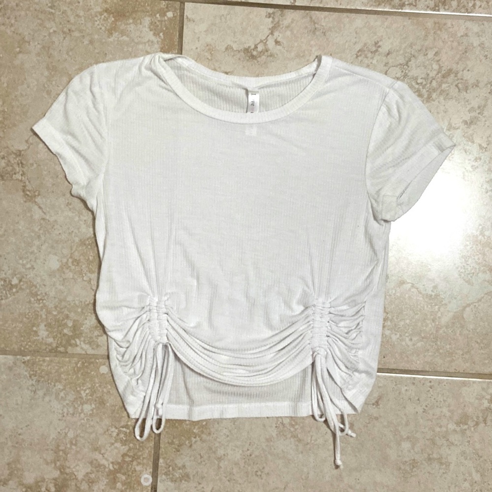 White top with adjustable straps on the sides